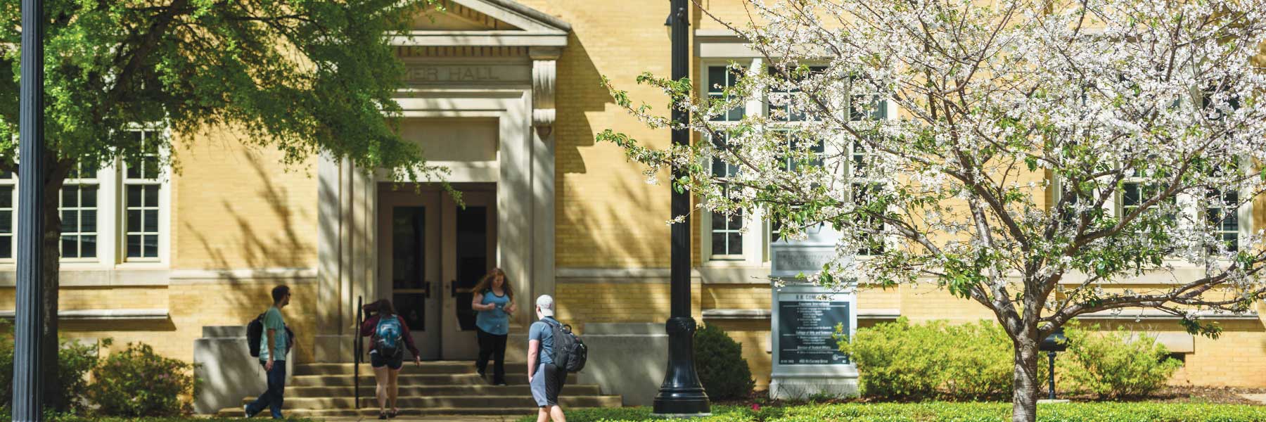 students walking in front of BB Comer Hall, home of the Modern Languages department